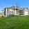 Homes for Rent in Belton, MO - Elm Grove - Front Yard with Manicured Grass, Newly Planted Trees, Attached Garage, and Driveway.