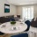 a living room with a table and chairs