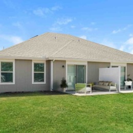 backyard of a house with green grass