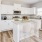 Belton, MO Rental Homes - Elm Grove - Kitchen with Luxury Vinyl Plank Flooring, White Shaker-Style Cabinets, Samsung Stainless Steel Appliances, Granite Countertops, and a Kitchen Island