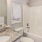 a bathroom with a tub sink and toilet