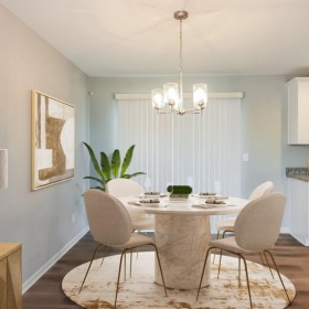 a dining room with a chandelier and a table