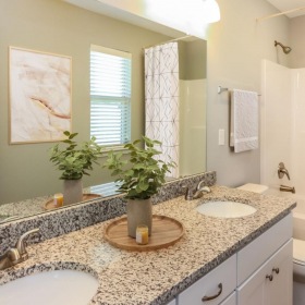 a bathroom with a marble countertop