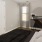 a bedroom with a bed and a piano