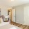 a bedroom with white doors