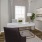 Belton, MO homes for Rent - Elm Grove - Office with Luxury Vinyl Plank Flooring, Desk, Chairs, Bookshelf, and Large Window.